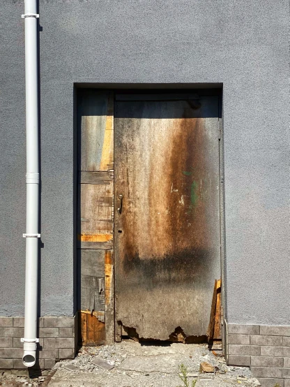 a fire hydrant outside of a building with a sliding door