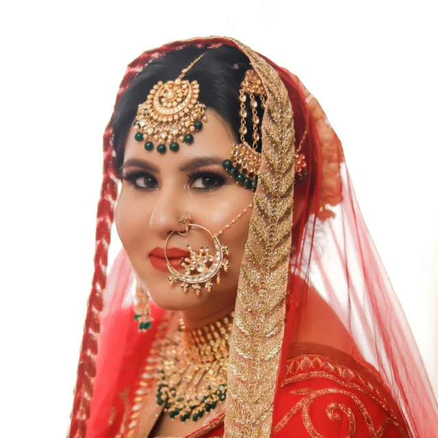 a beautiful young woman dressed in traditional indian garb