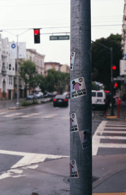 a pole with some stickers stuck to it