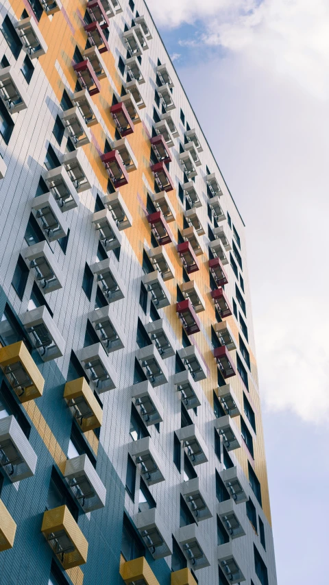 an unusual multicolored building on a sunny day