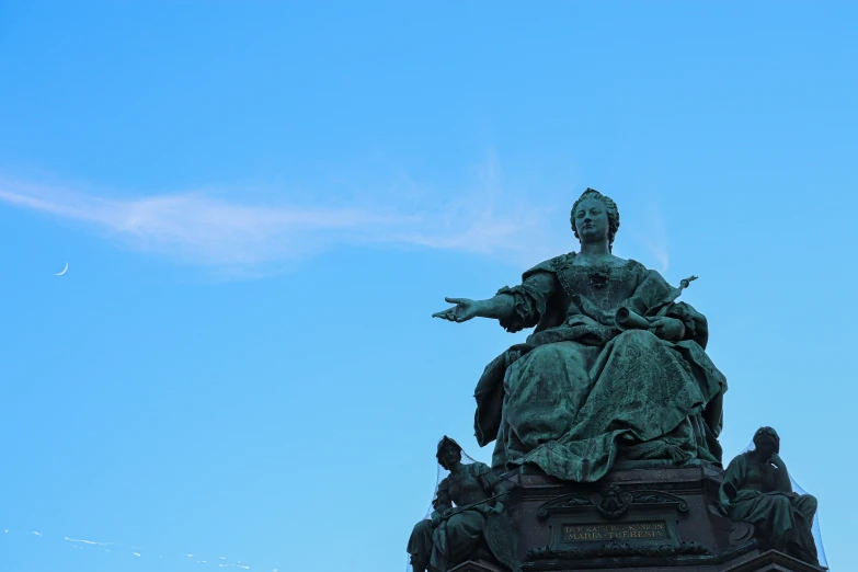 statue of lady justice on the top of a large building