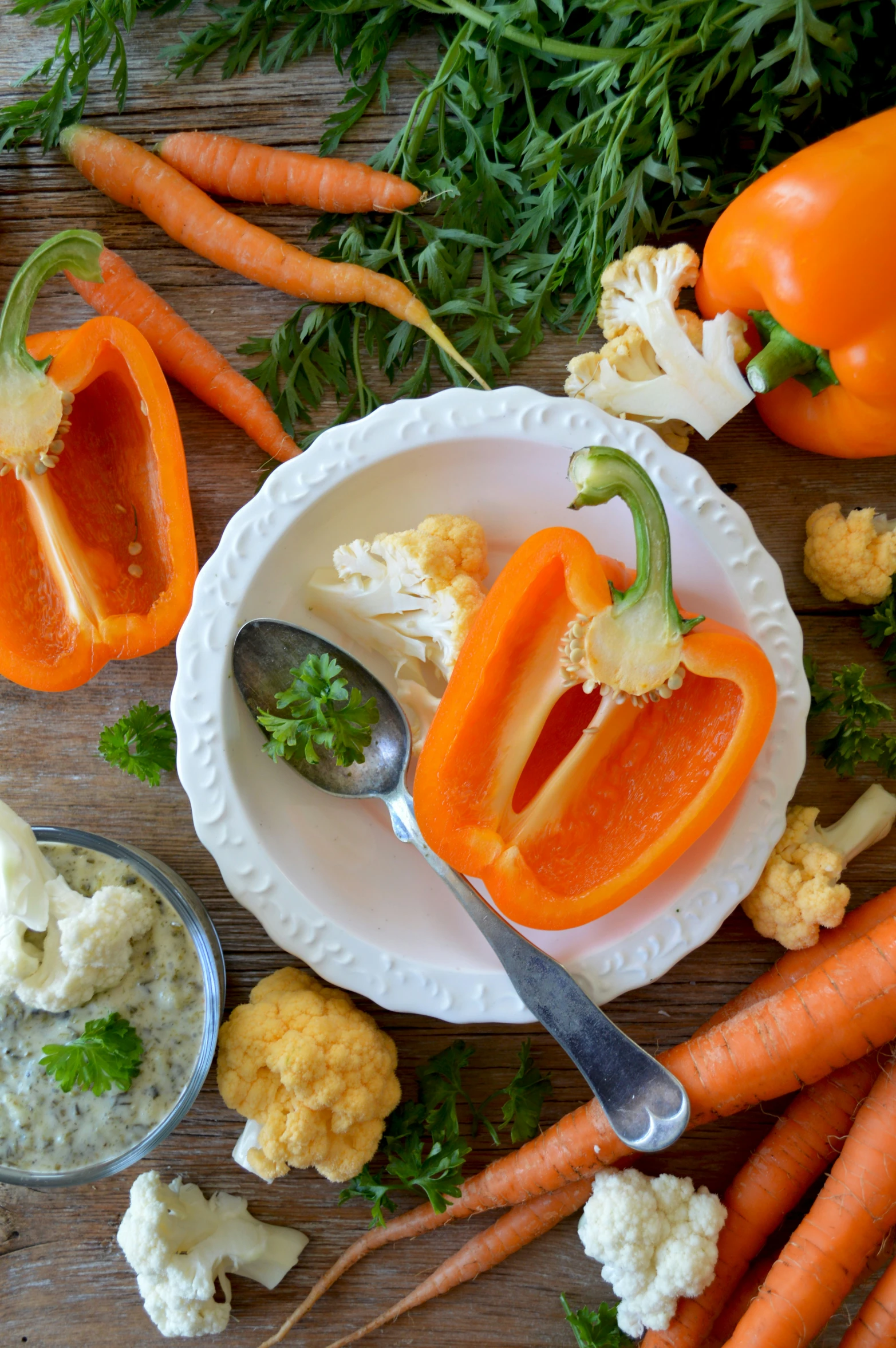 this is a plate with carrots and peppers on it