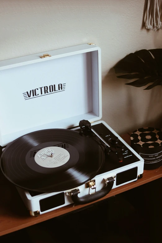 an old fashioned suitcase has a record player