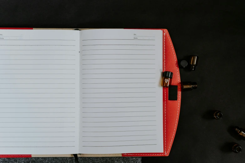 an open notebook is laying on a table