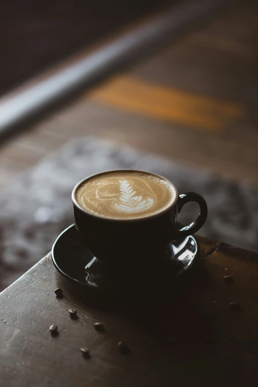 a coffee cup sitting on a table at an airport