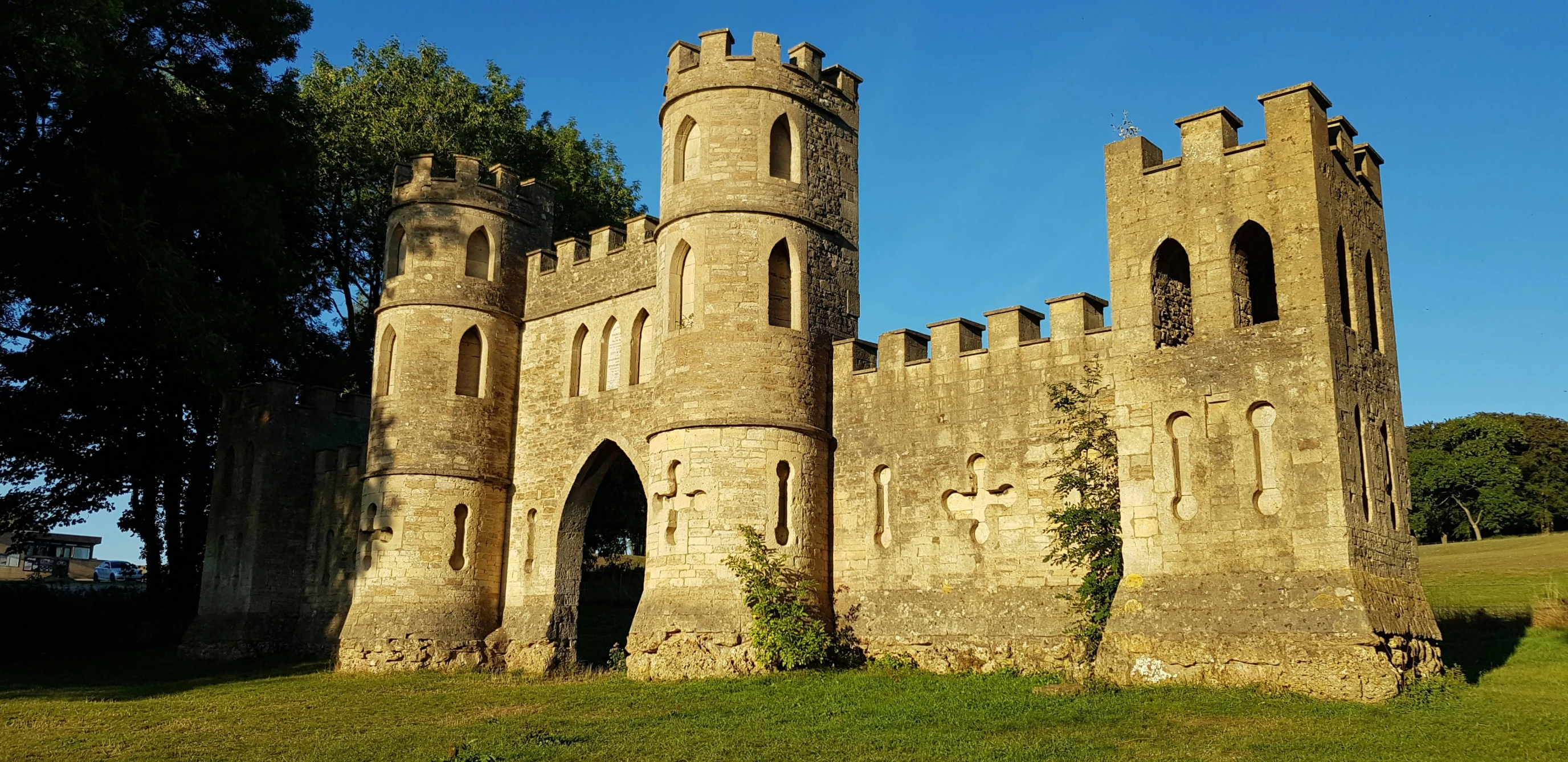 a large brown castle with trees around it