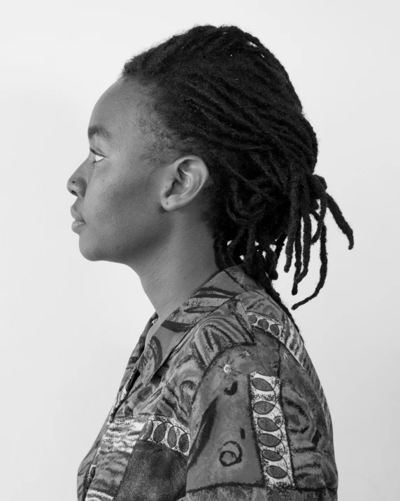 a woman with dreadlocks wearing a shirt