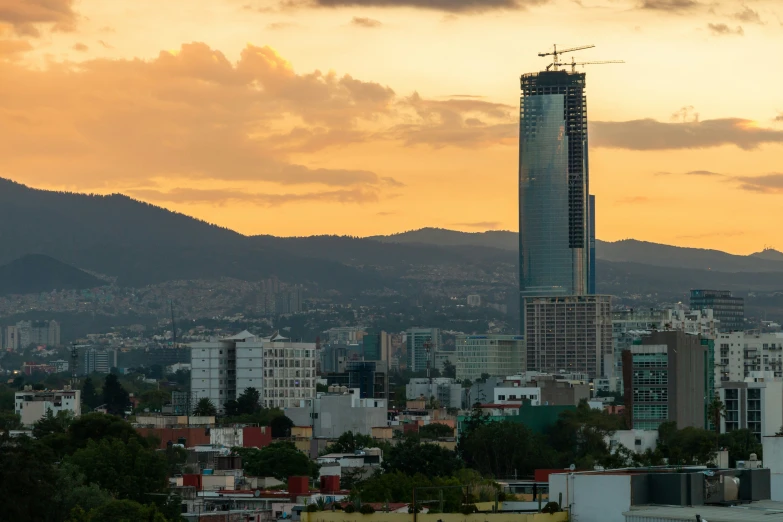 an overview of a city with mountains in the background