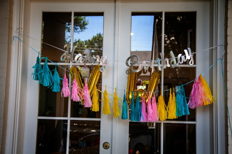 a front door with two rows of tassels and decorations