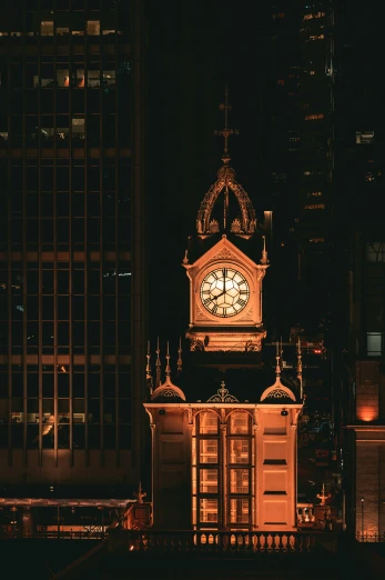 the clock tower at night shows 6 35