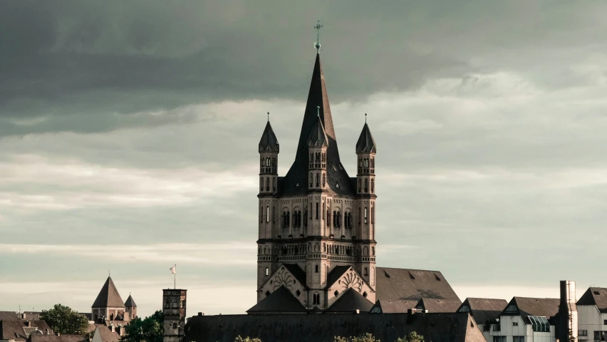 an old church tower next to the river