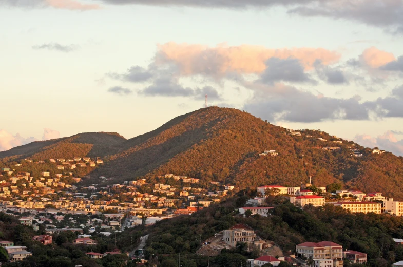 the view from a distance shows mountains and houses