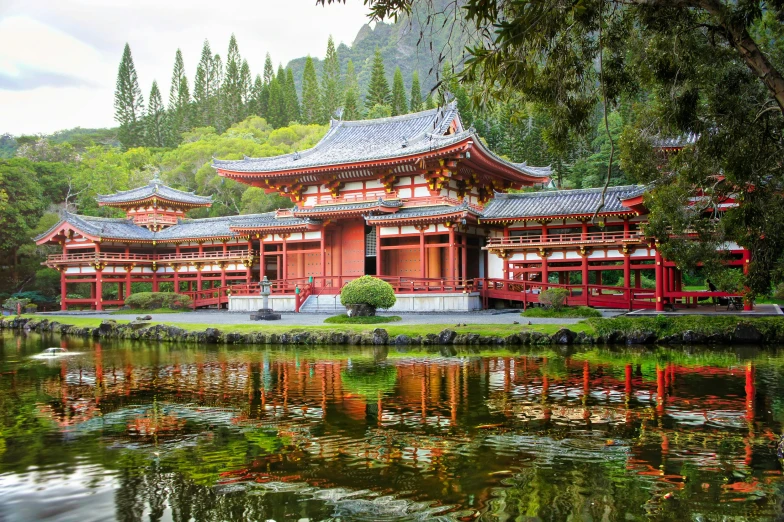 two pavilions in an oriental style overlook a body of water