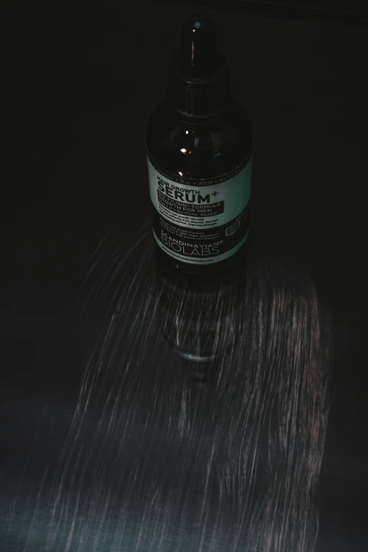 a bottle of silver metallic hair coloring sitting on top of a table
