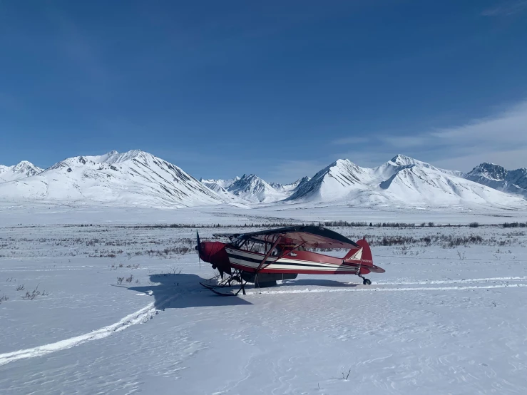 a snow covered field that has some planes on it