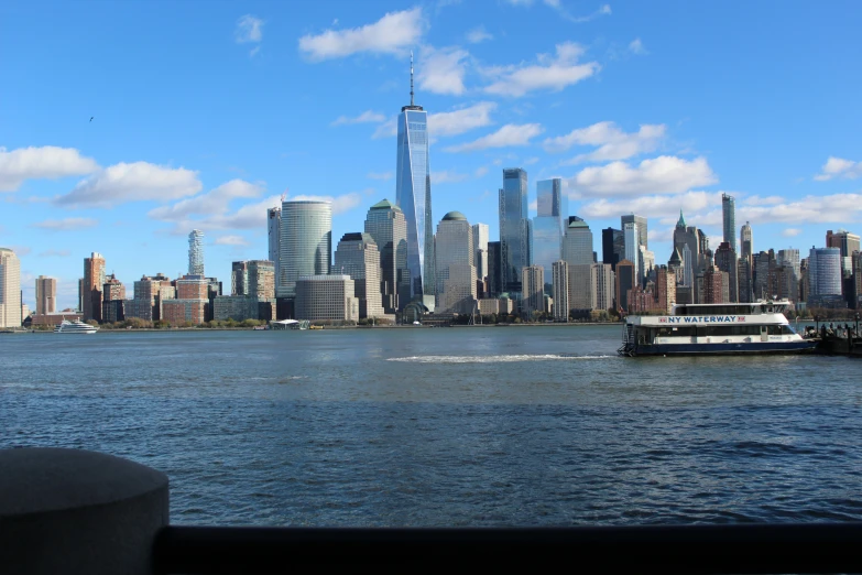 the city skyline in new york is seen across a large body of water