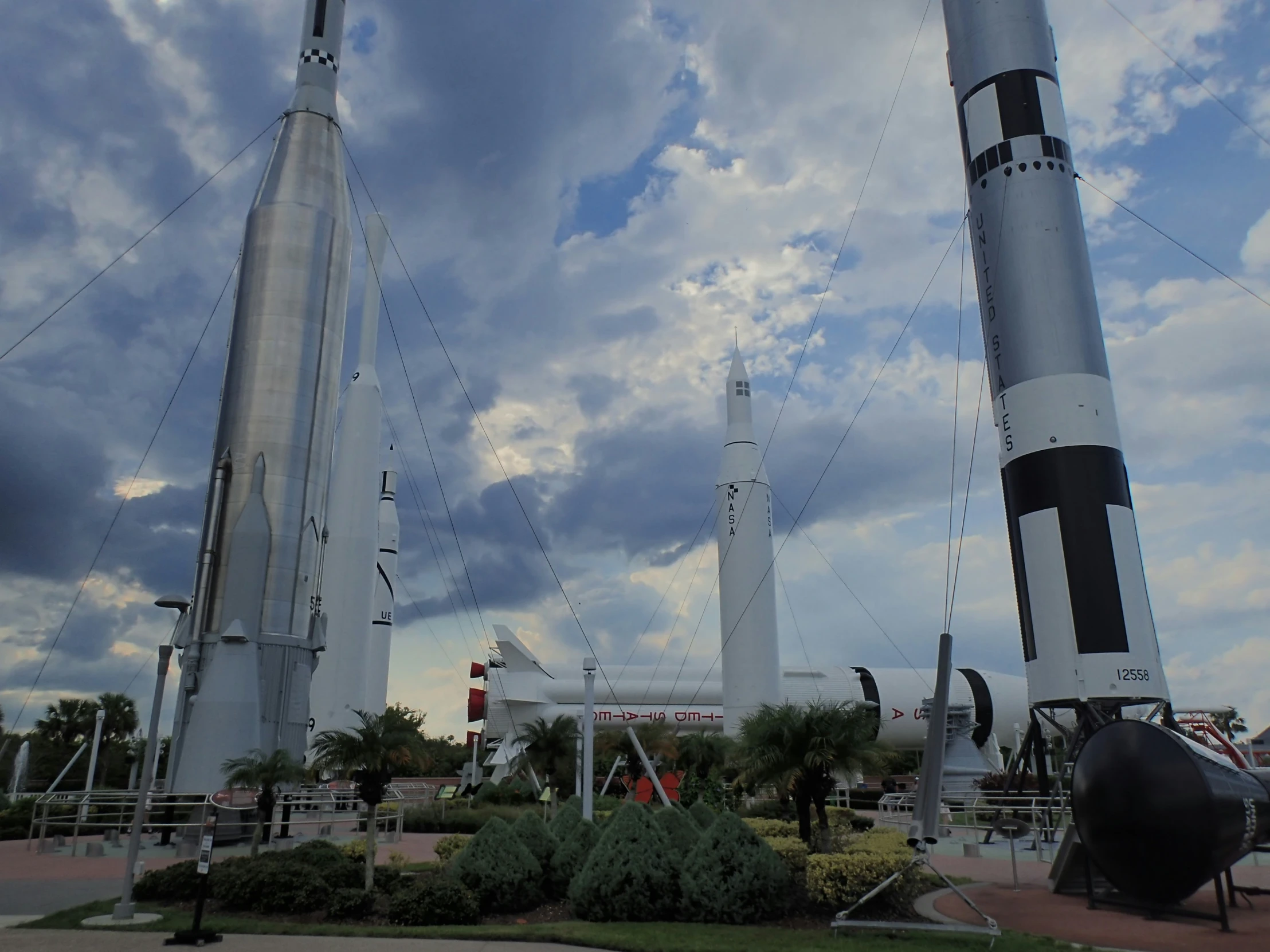 a group of different sized rockets sitting on a platform