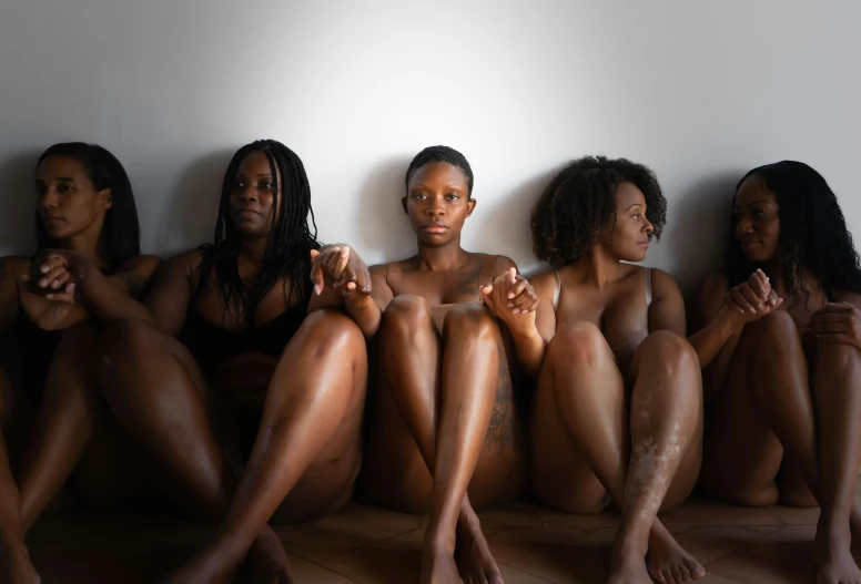 an image of  women sitting on the floor