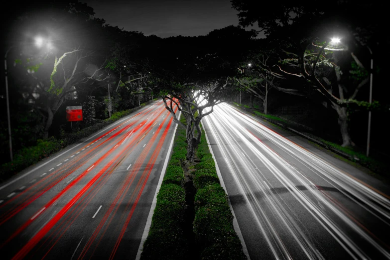 traffic on highway at night time with the headlights turned red