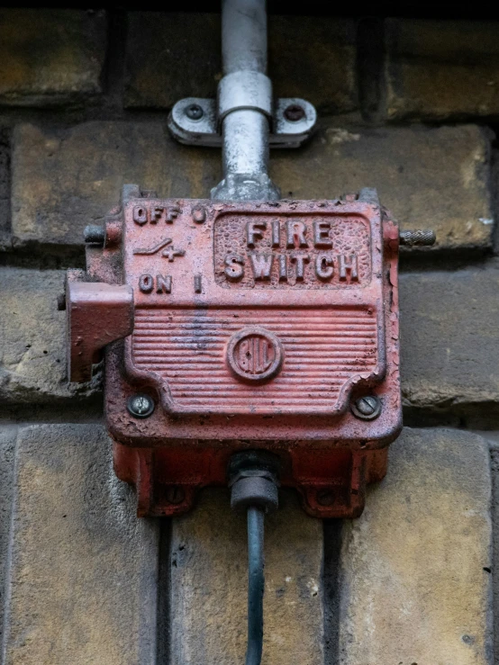 the valve is on the brick wall in front of the window