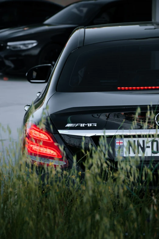 a car that is parked near some grass