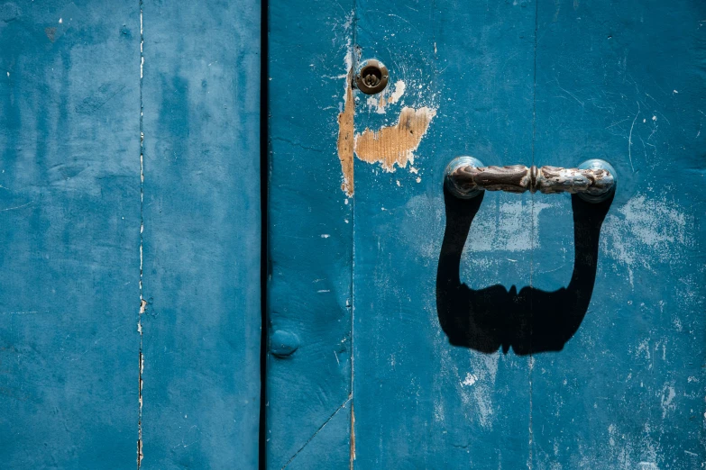 an image of an old lock on a blue door