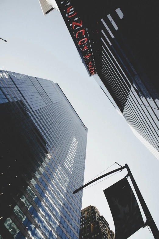 an upward view of some tall buildings in a city