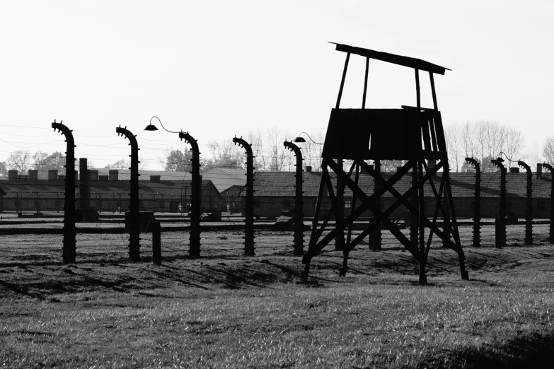 the old guard tower in a barbed wire field