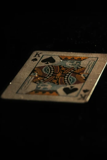 a card with four of spades and playing cards on it