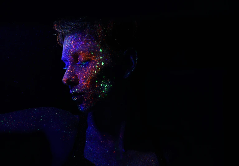 a person with many glowing spots on their face