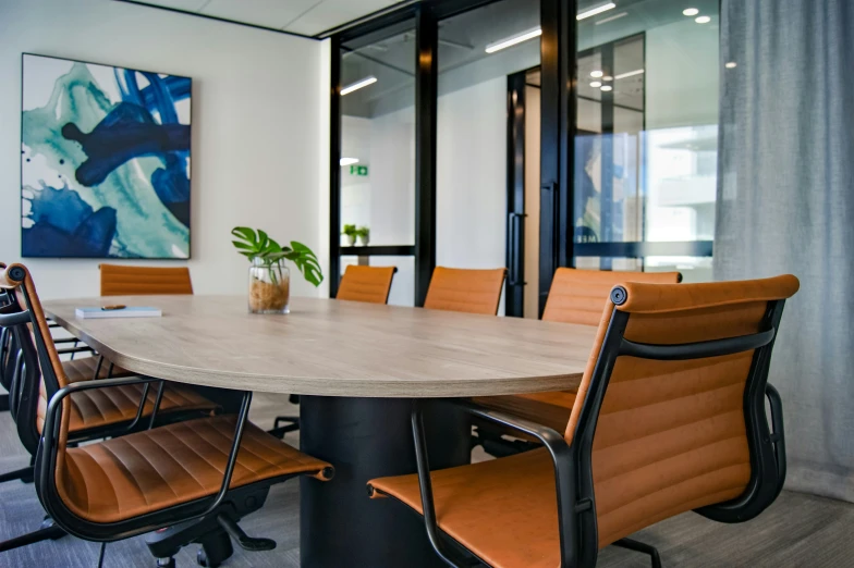 an empty conference table sits in the middle of the room