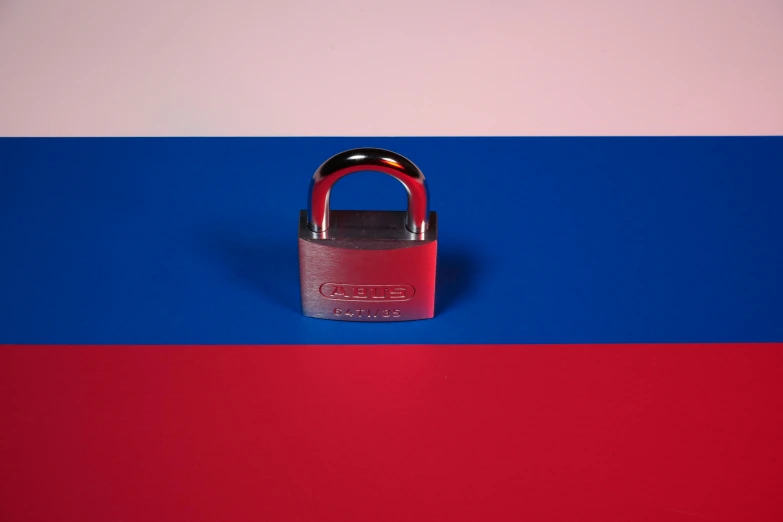 a red, blue and pink surface with a padlock