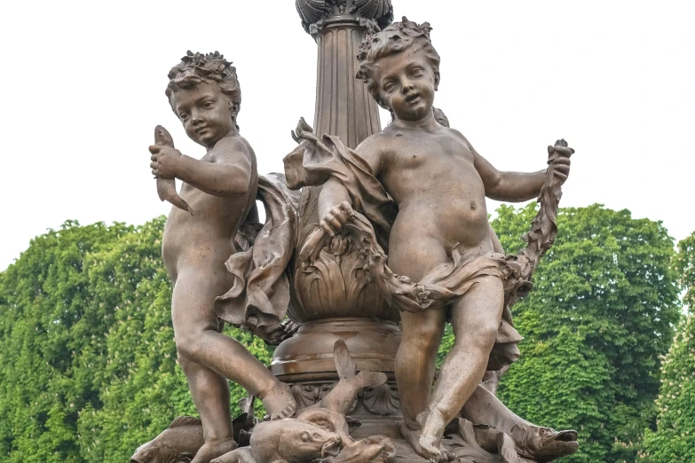 a group of statues that have been placed in a fountain