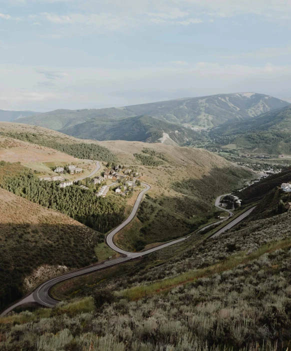 road going down hillside to the valley below