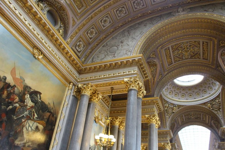 a building with columns and paintings on it