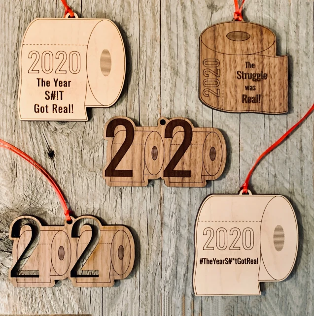 wood ornament with numbers in the shape of two rolls of toilet paper