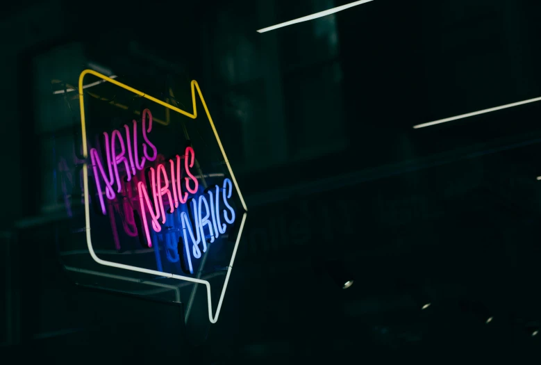 a neon sign has writing and lights on it