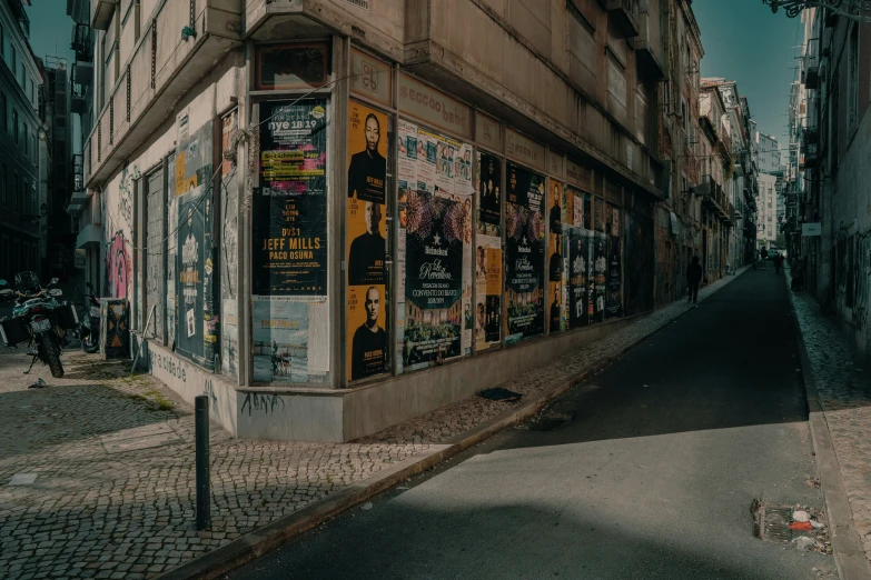 a street has a bus stop and people walking near it