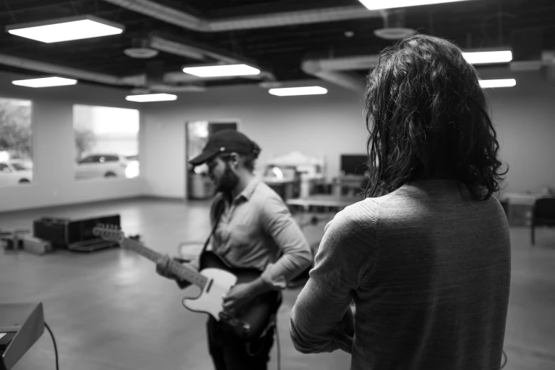 a couple of people that are playing guitar