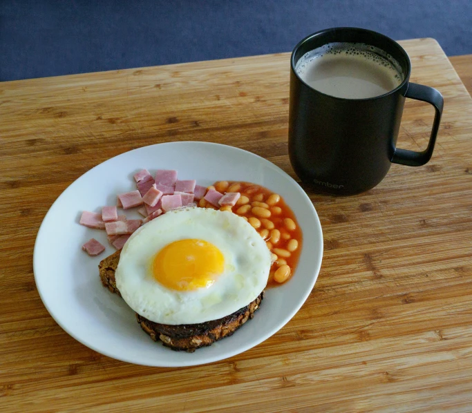 a plate of food that has a toast with eggs on it