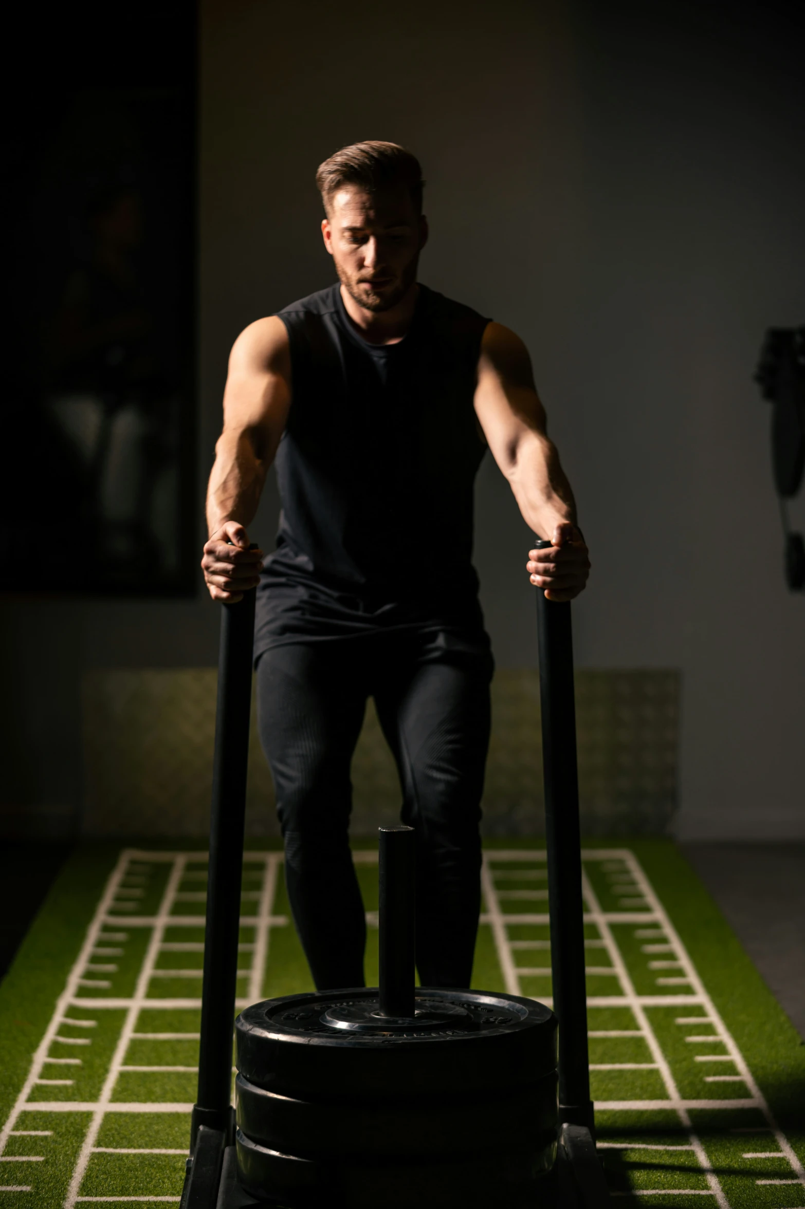 a man standing on top of a tire in a room