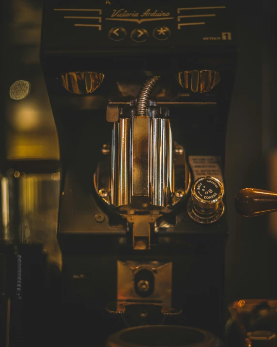 a close up image of an old fashioned juicing machine