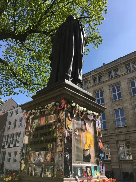 a monument with a statue next to it