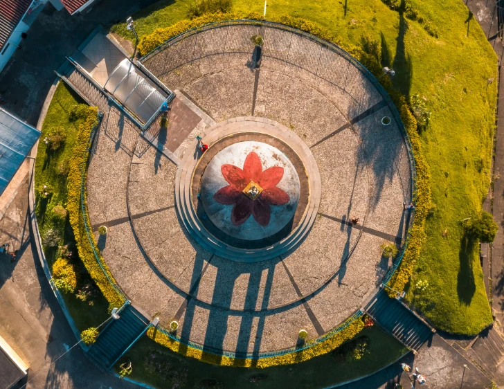 an aerial view of the park, with circular sculpture