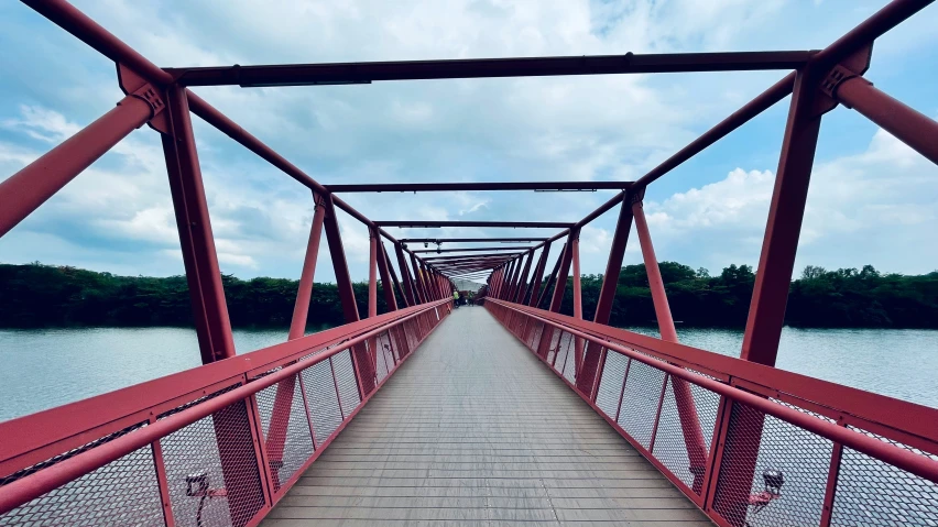 the walkway over the water leads to an overpass