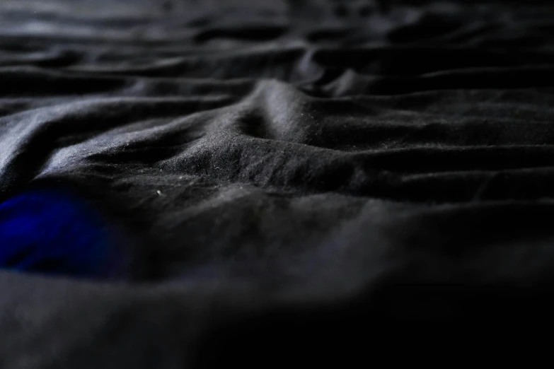 an image of black and blue material blurry