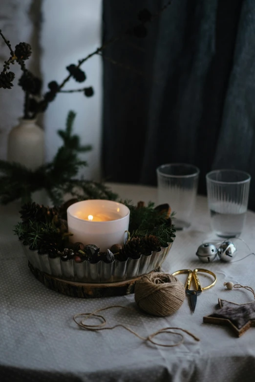 a cupcake with a lit candle on top of it