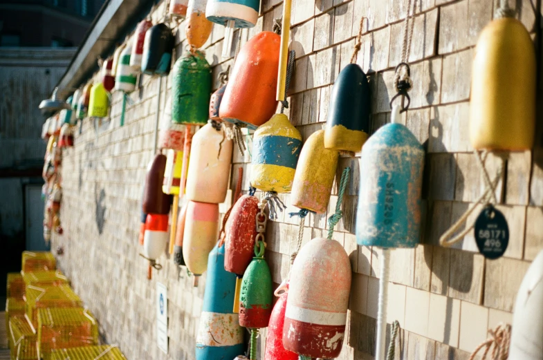 an array of buoys displayed at a storefront
