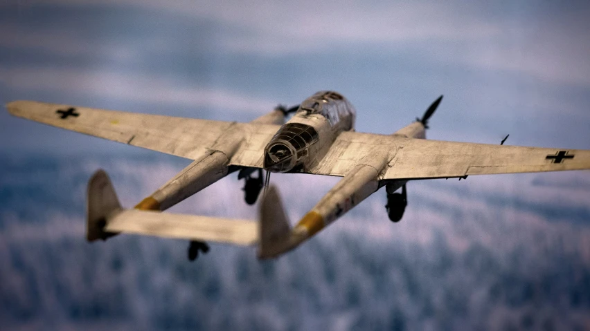 a plane is flying over a blue cloudy sky