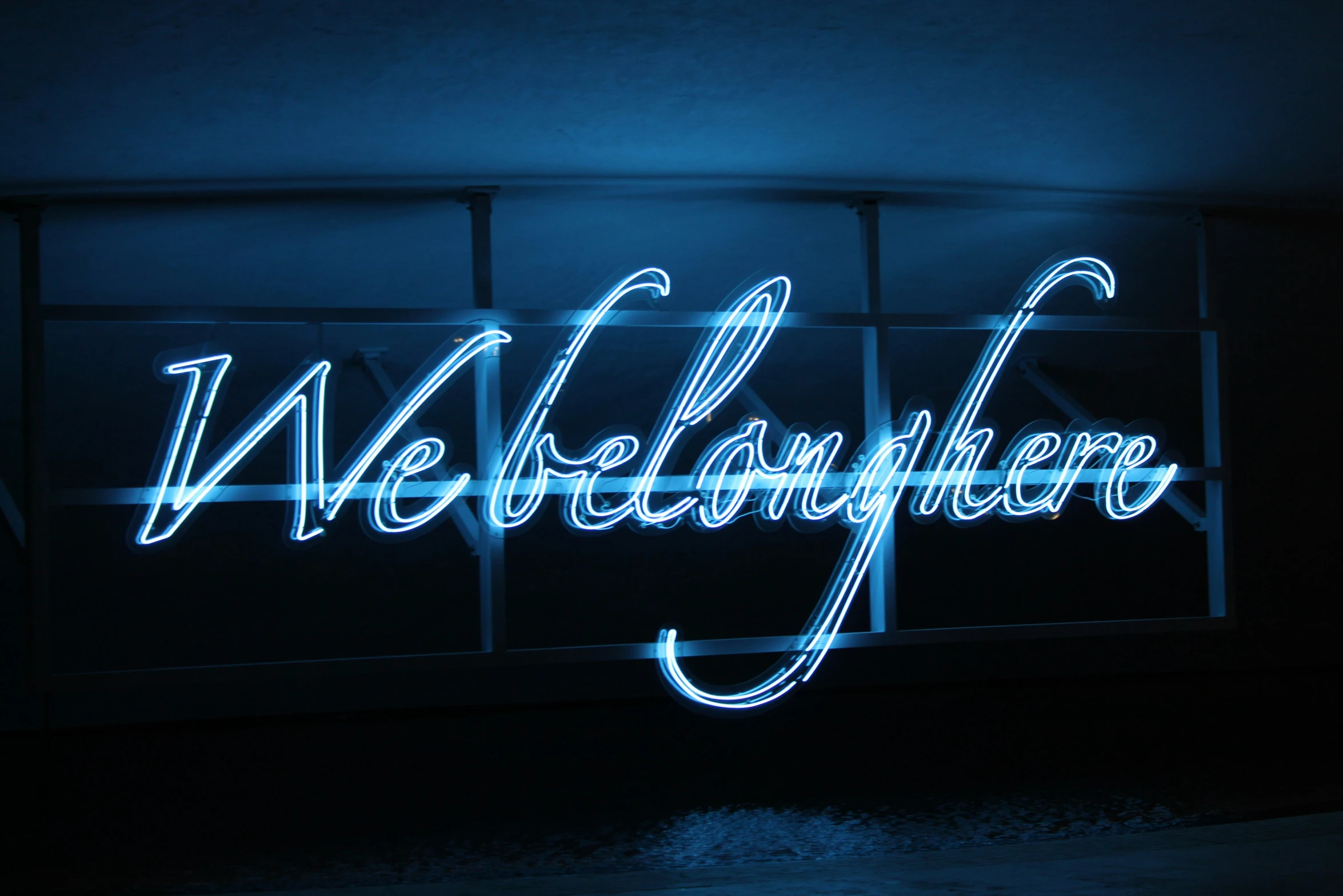 neon sign in blue lights with white writing on it